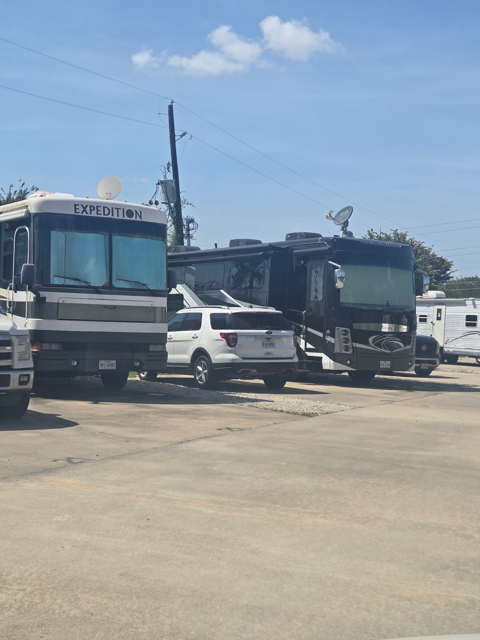 Class A motorhomes including an Expedition coach parked at The Bend RV Park